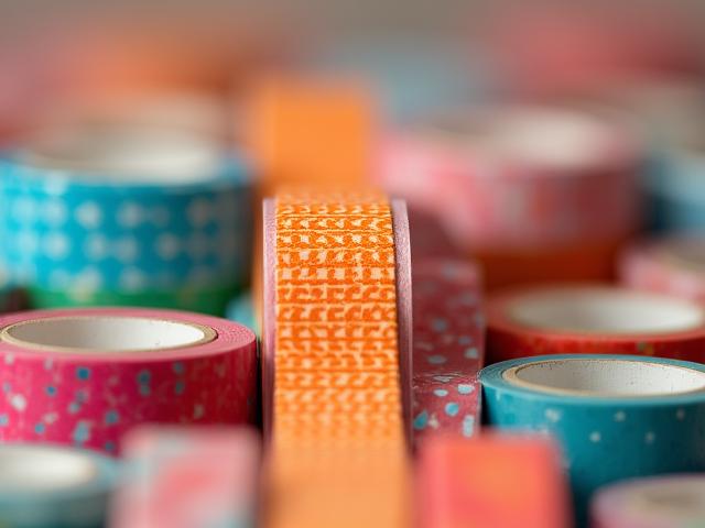 Close up of organized colorful washi tape rolls